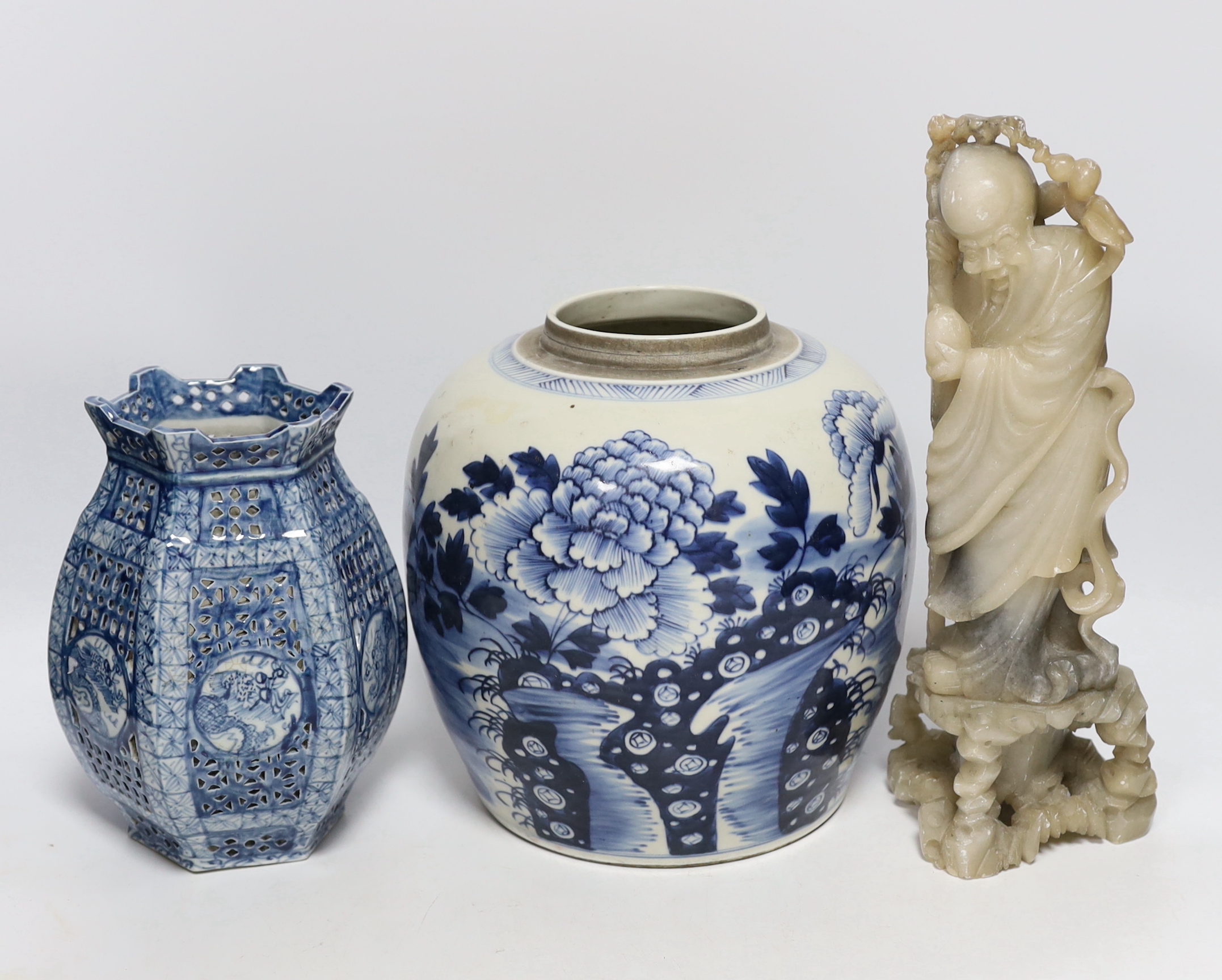 A Chinese blue and white jar and a soapstone figure, 31cm high